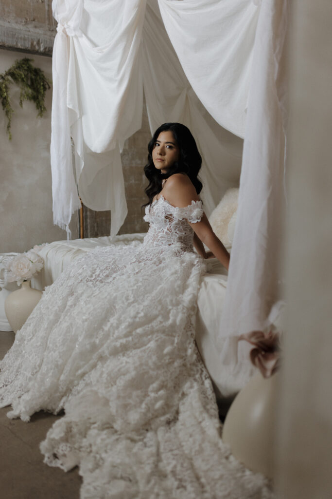 Bride Cindy in a detailed lace wedding dress during her bridal portraits at a dreamy studio in Dallas, Texas.
