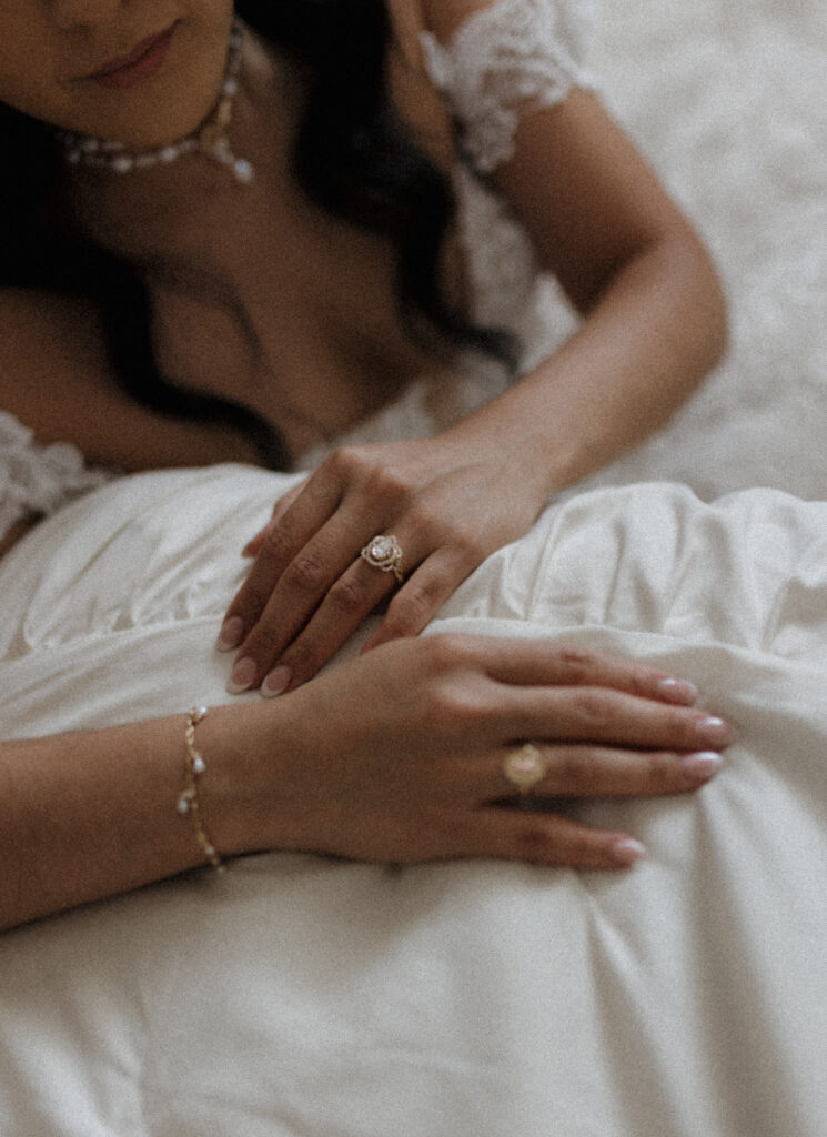 Close-up of lace wedding dress details during bridal photo session in Dallas studio
