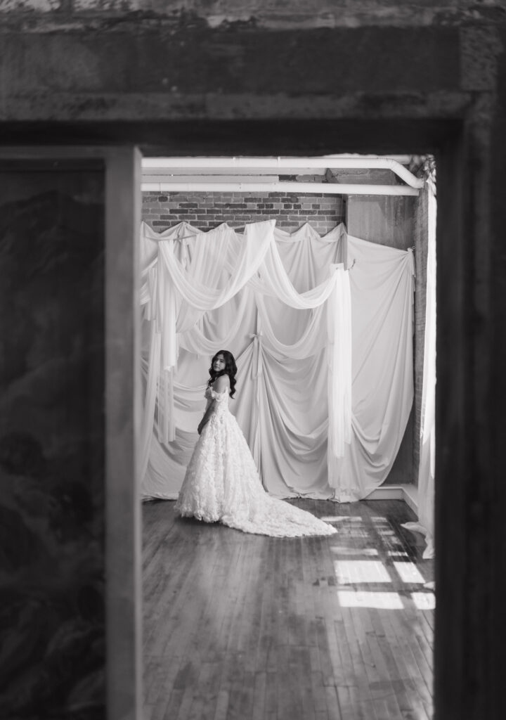 Editorial bridal photography in Dallas studio space featuring a bride in lace gown with romantic details.