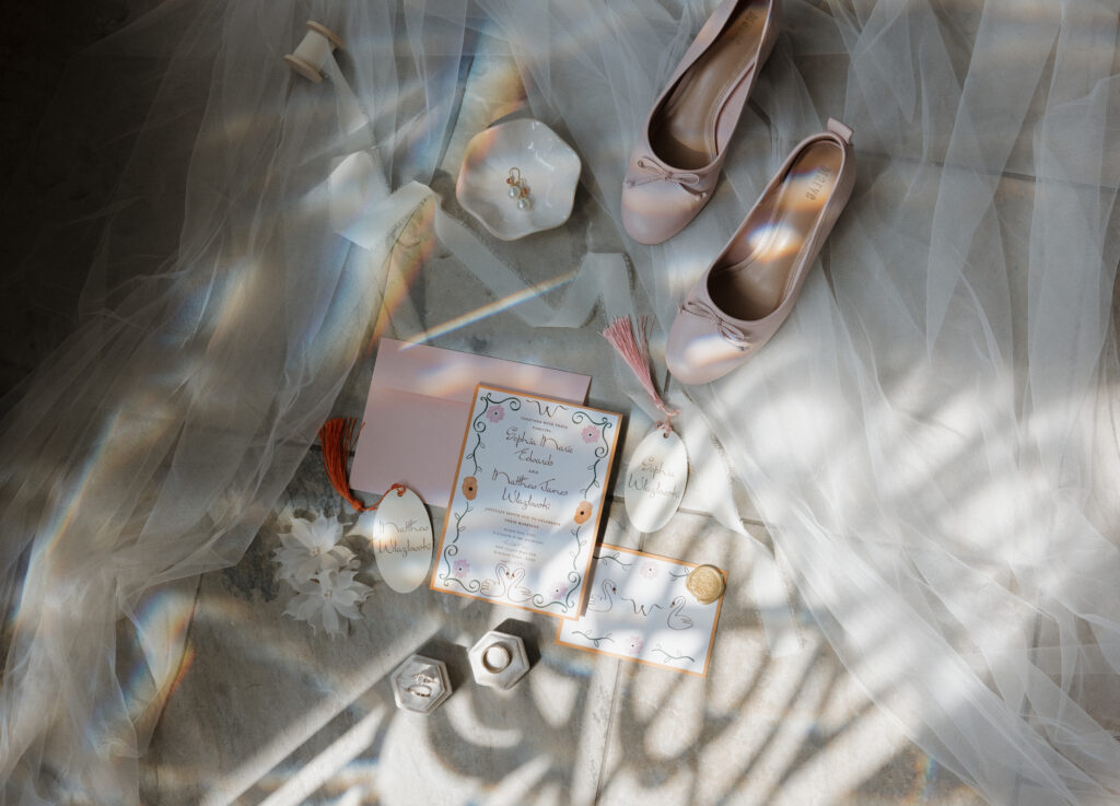 Artistic flatlay featuring personalized name tags and gold wax seals at The Belle Manor.